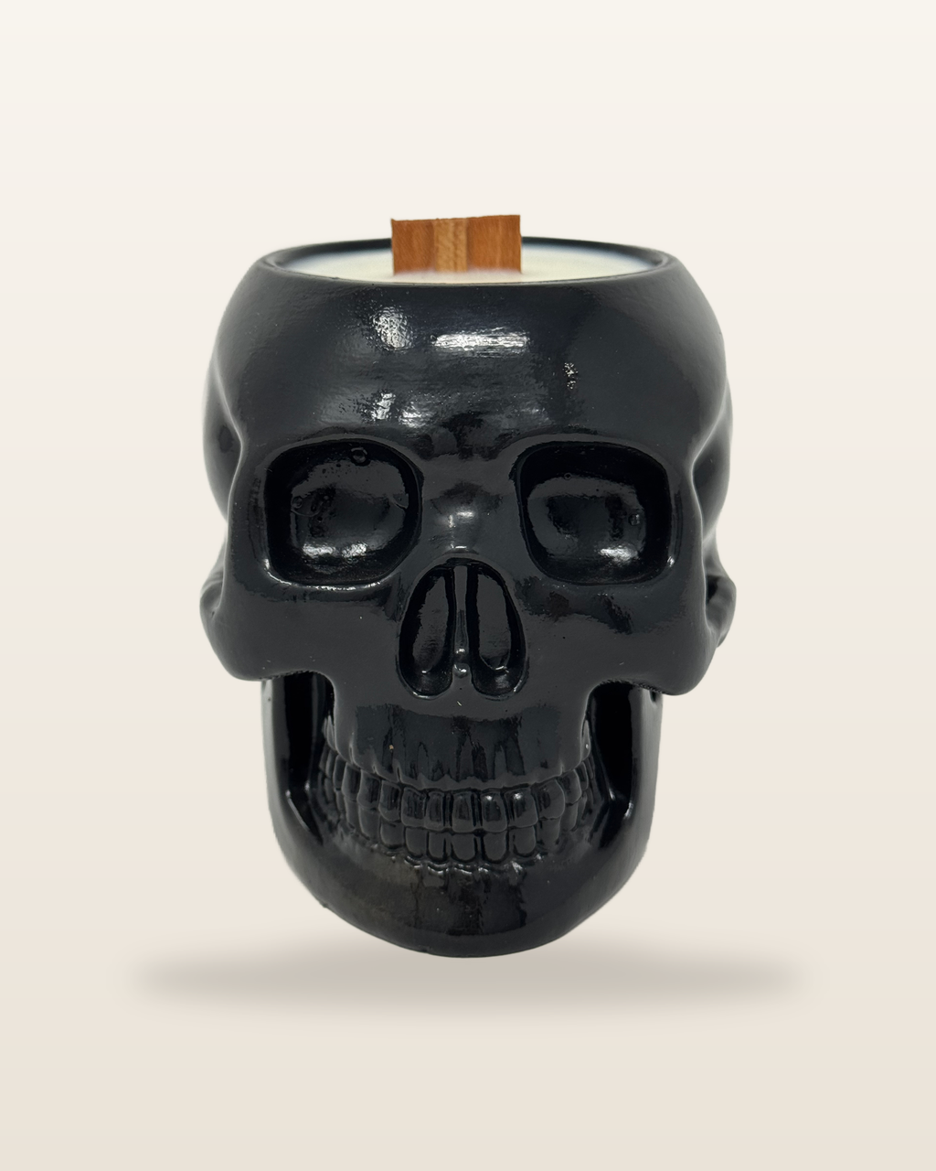Realistic Skull candle in black cement with a wooden wick