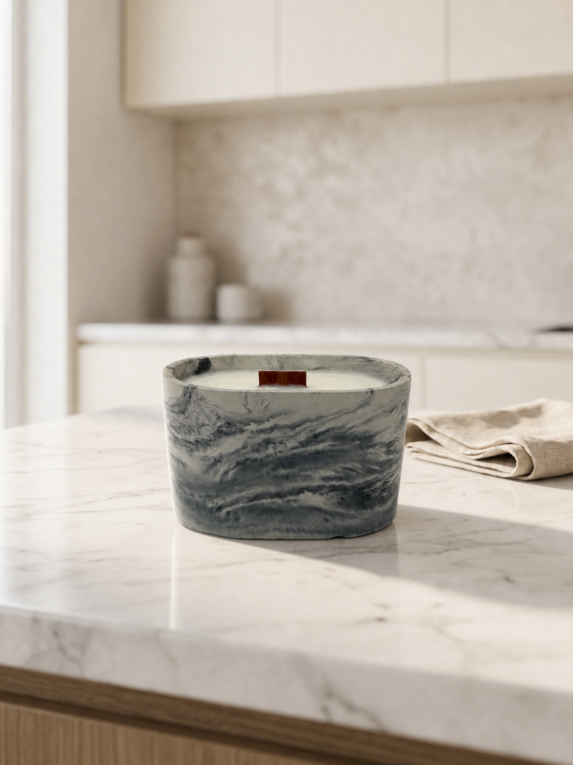 A marbled candle in a light kitchen