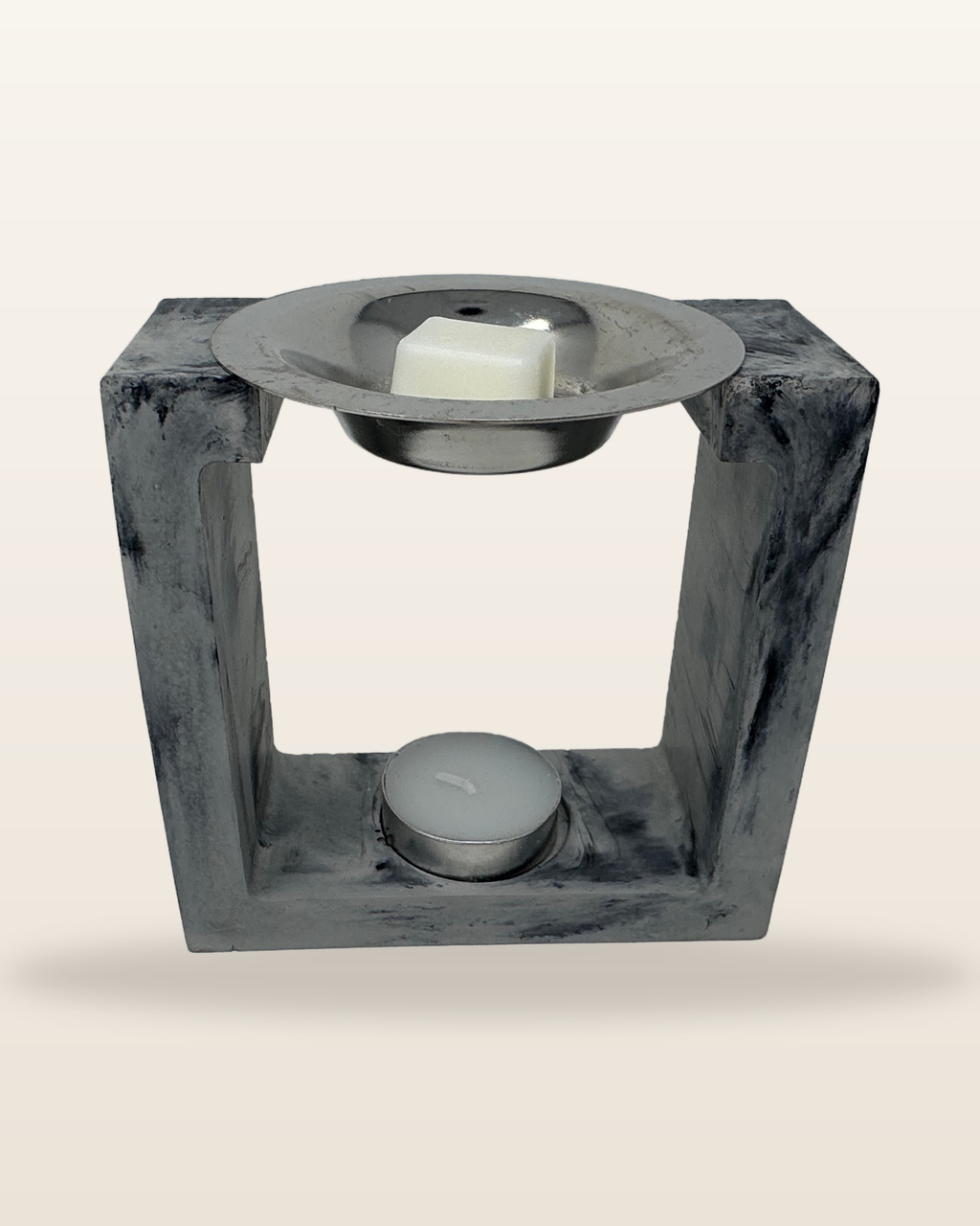 Square cement wax melter in grey and black marble with a tealight and wax melt